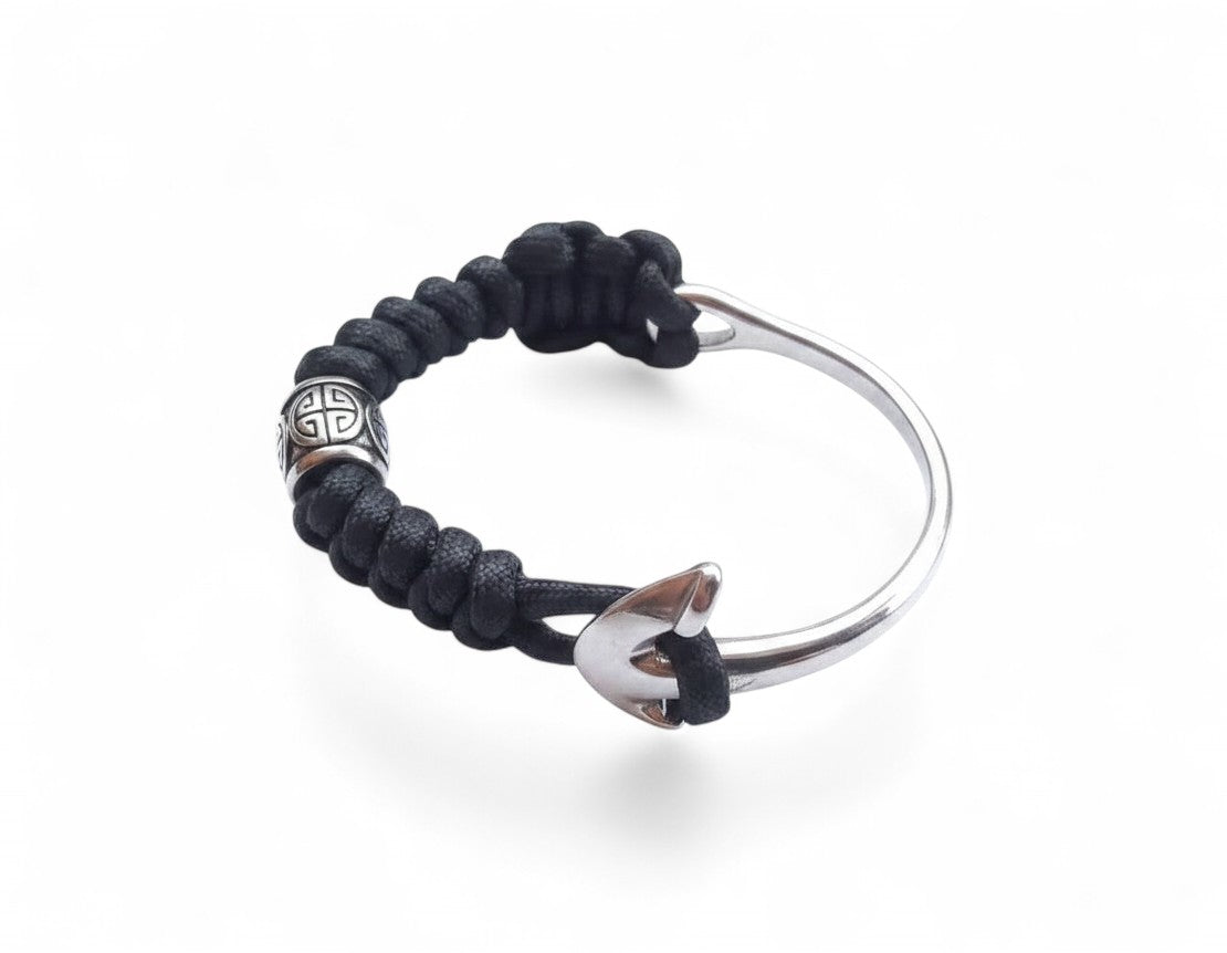 Magillas anchor bracelet with black snake cord and stainless steel hardware on a white background