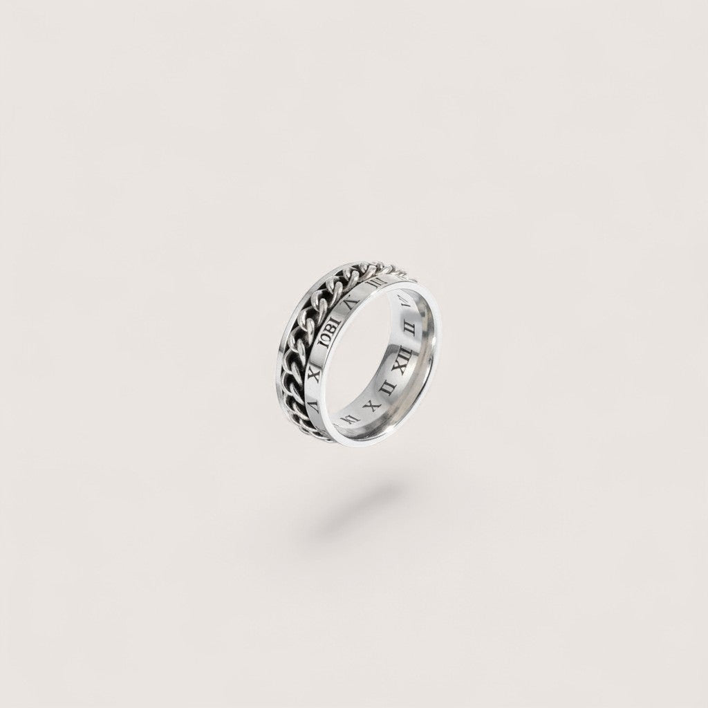 Anillo antiestrés de acero inoxidable con diseño de cadena y números romanos. Magillas