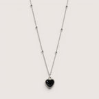 Collar de acero inoxidable Magillas con colgante de corazón negro que cambia de color con la temperatura.