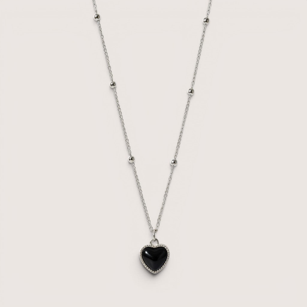 Collar de acero inoxidable Magillas con colgante de corazón negro que cambia de color con la temperatura.