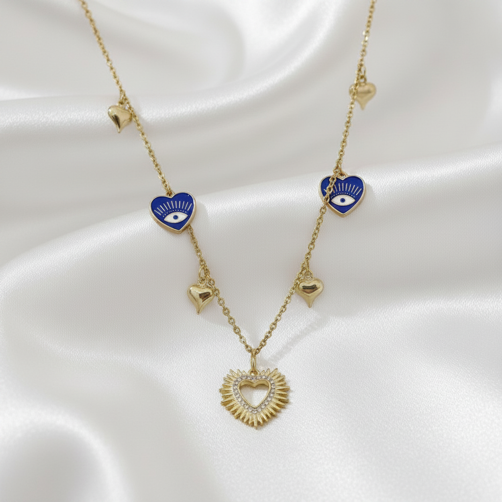 Collar Magillas de cadena dorada con dijes de corazones azules con ojo turco y corazón central tipo sol
