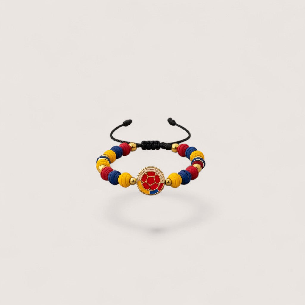 Magillas handmade Colombian flag soccer ball charm bracelet with yellow, blue, and red beads and gold spacers.