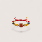 Magilla's Colombian football fan bracelet with red, yellow, and blue beads and a soccer ball charm.