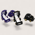 Magillas estuche para anillo con forma de coche vintage, terciopelo negro con detalles dorados y ruedas doradas.