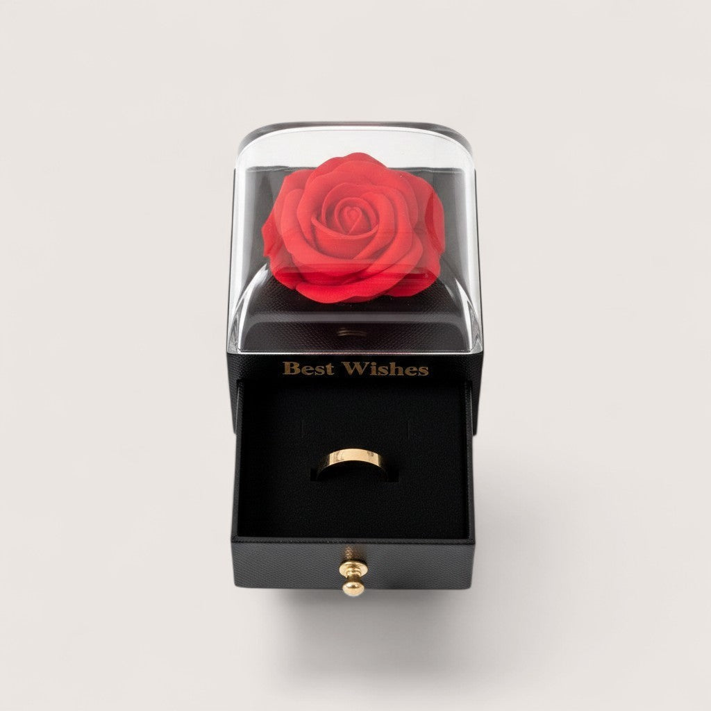 Magillas preserved red rose jewelry gift box with a matte black base, clear dome, and pull-out ring drawer.