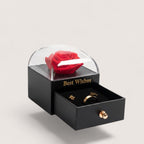 Magillas preserved red rose jewelry gift box with a black matte base, clear dome, and pull-out drawer for jewelry.