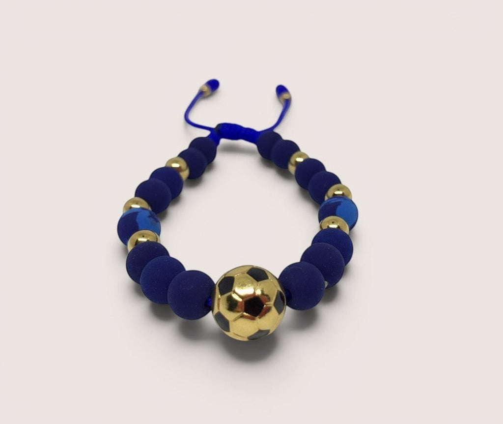 Pulsera Magillas de acero inoxidable, neopreno y rodio con cuentas azules y un balón de fútbol dorado.