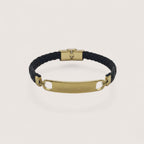 Pulsera esclava de cuero trenzado negro con placa personalizable de acero inoxidable y cierre dorado de Magillas.