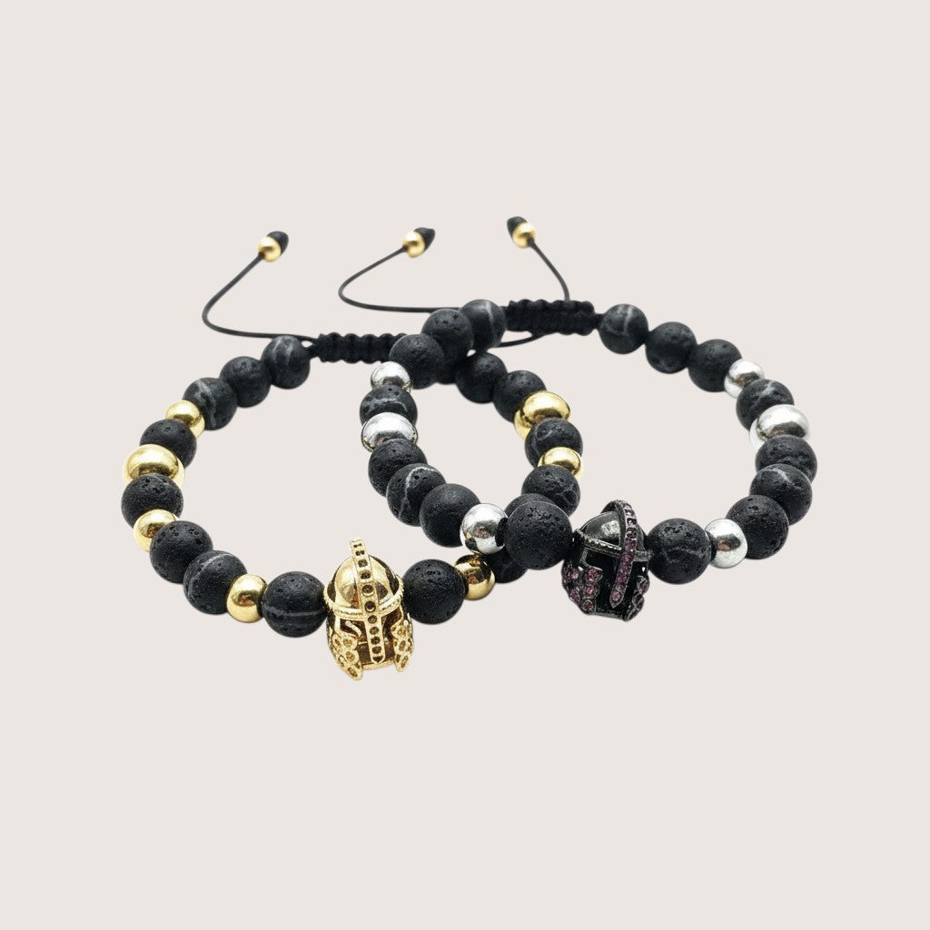 Magillas pulsera gladiador de acero inoxidable, neopreno y rodio con cuentas de lava y cascos dorados y plateados.